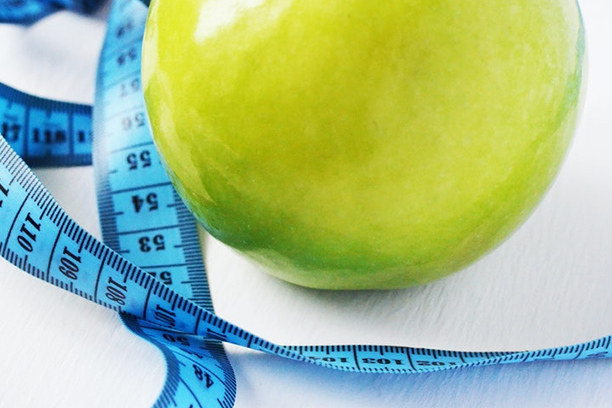 apple with measuring tape