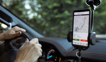 driver with phone on docking station
